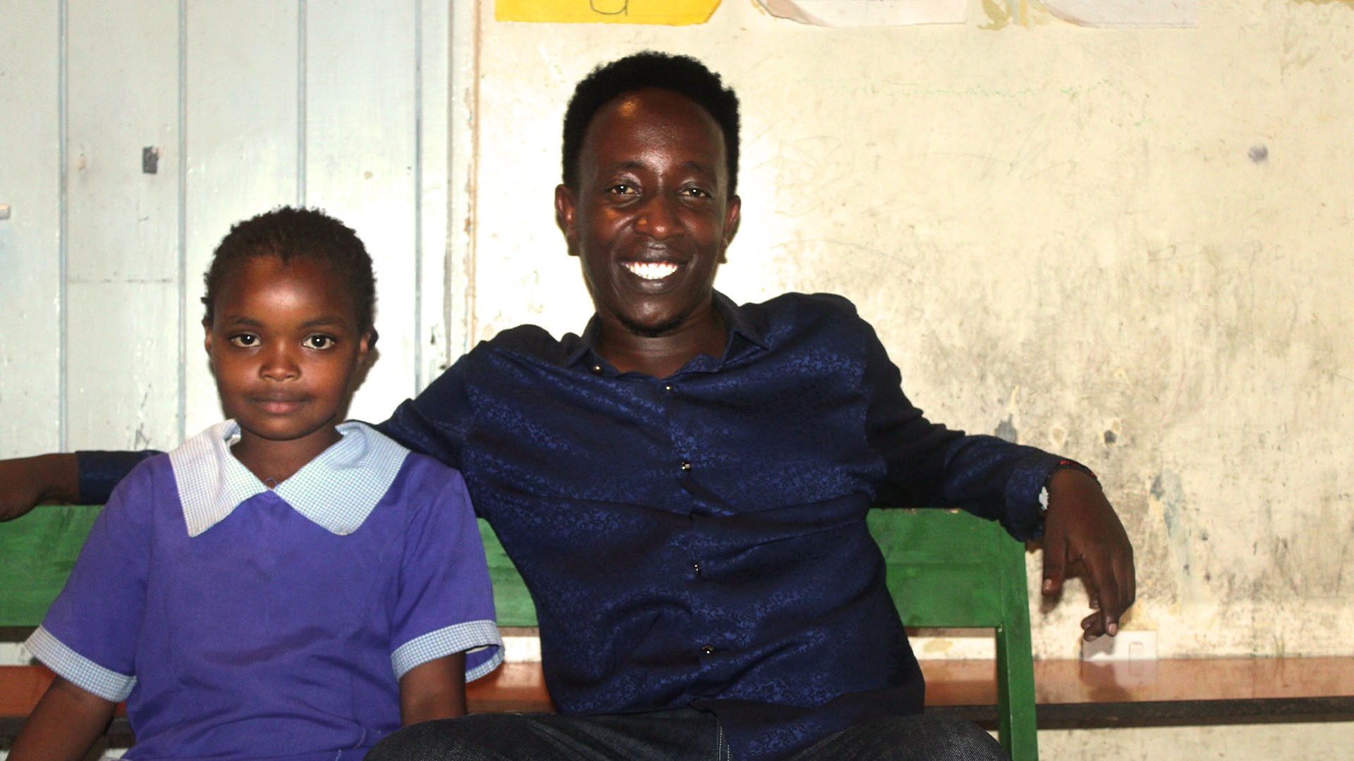 Ashford Njonjo Muiriru with one of the kids he is sponsoring